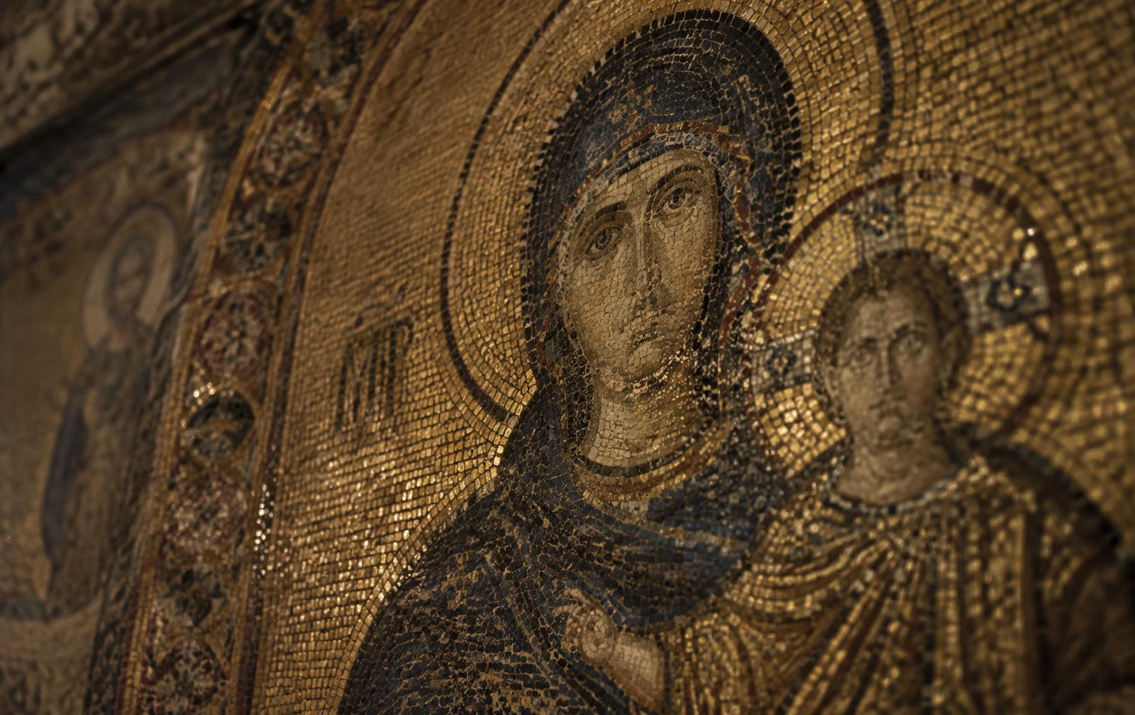 Close view of gold Byzantine mosaic tesserae on a basilica wall